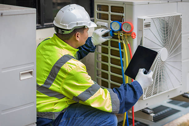 Professional Hvac technician working in Logan, AL
